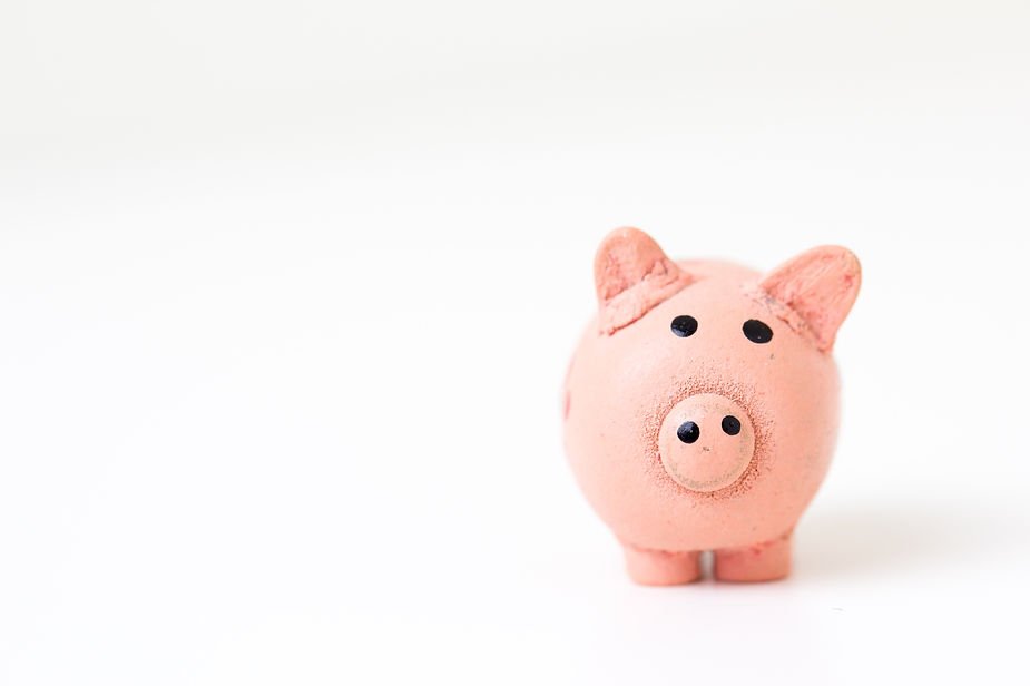 A pink piggy bank on a white background, centered with a minimalistic and cheerful vibe.
